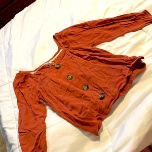 Rusty orange shirt that’s a little cropped